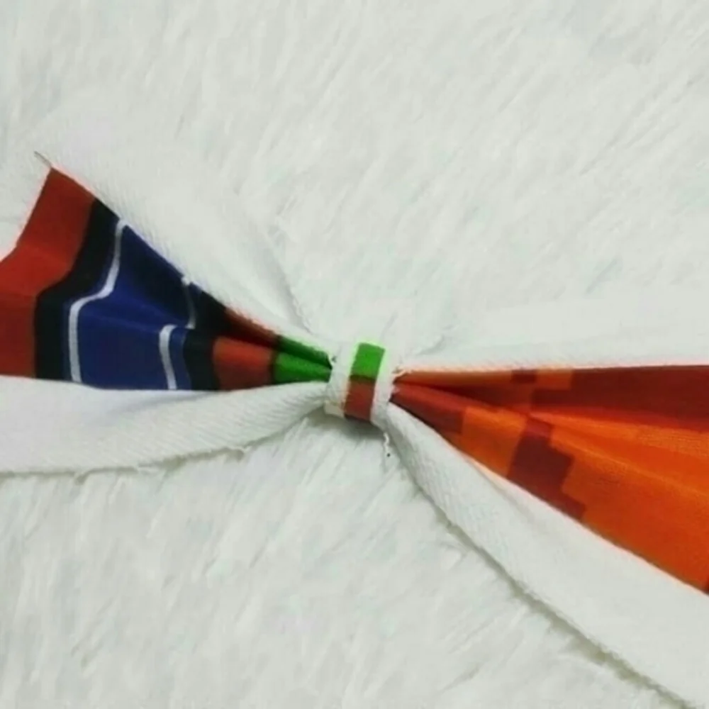 Tasty Raw Edge White Denim & Kente Bow Collar Pin
